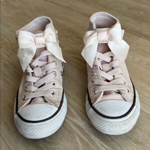 Converse pink bow high top sneakers